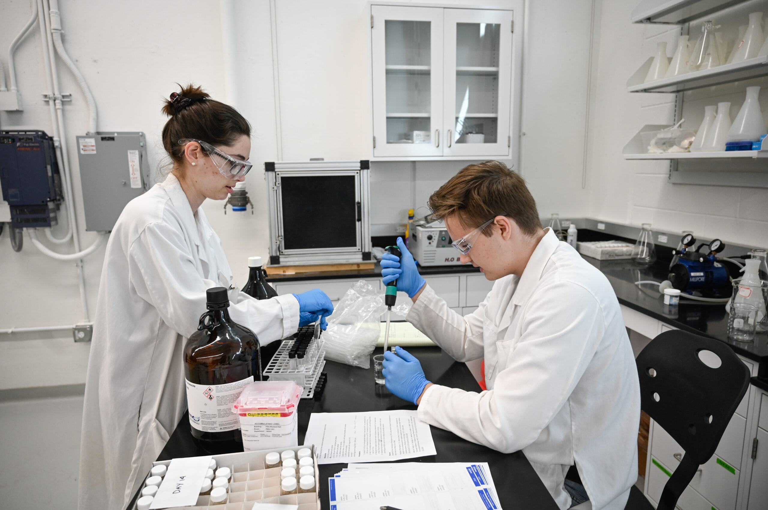 Students work with samples in the Hydraulics Lab in Fitts-Woolard Hall on Centennial Campus.